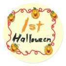 round_sticker - A text and jack o lantern design on Halloween T-shirts, bodysuits, and more featuring several smiling jack o lanterns and kid style  text that reads "1st Halloween"!: Sizes 