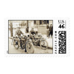 2 men riding motorcycles postage stamps