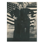 2 sailors front of flag postcard