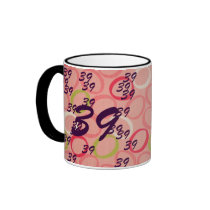 39 & Holding Coffee Mug