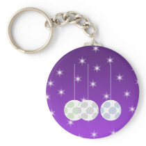 3 White Swirl Design Christmas Baubles. On Purple Key Chain