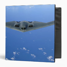 A B-2 Spirit soars through the sky Binder