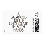 A balanced diet is chocolate in both hands postage stamp
