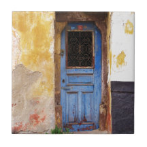 A beautiful rustic old blue door in CRETE, Greece Tile