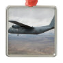 A C-130 Hercules soars through the sky Christmas Tree Ornaments