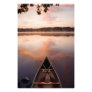 A canoe rests on the shore of Pawtuckaway Lake