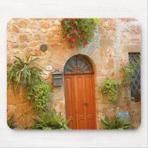 A cat seeks entrance to home in Pienza, Italy. Mousepad