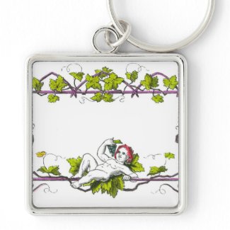 A cherub lounging on a trellis eating grapes keychains