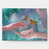 A cute baby boy in hand fantasy envelopes