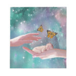 A cute baby in hand fantasy notepads A cute baby in hand fantasy notepads