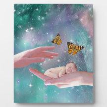 A cute baby in hand fantasy photo plaque