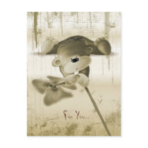 A cute teddy bear with a flower - postcard