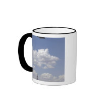 A CV-22 Osprey flies over a C-130 Hercules Coffee Mugs