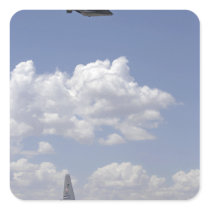 A CV-22 Osprey flies over a C-130 Hercules Square Sticker