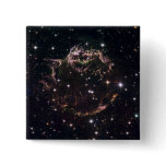 A detailed view at the tattered remains pinback buttons