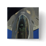 A F-22 Raptor receives fuel from a KC-135 Pinback Buttons