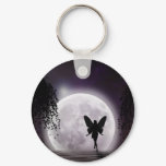 A fairy silhouette against a shining moon keychains