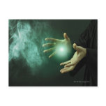 A fantasy wizard making magic with his hands. postcards