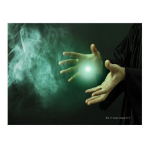 A fantasy wizard making magic with his hands. postcards