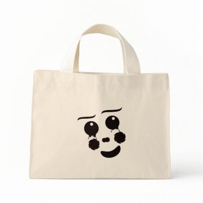 A fun whimsical clown face design graphic tote bags by SusansZooCrew