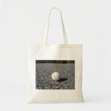 A golf Ball resting on gravel Tote Bag