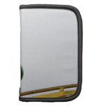 A green caterpillar goofy fair ride image folio planner
