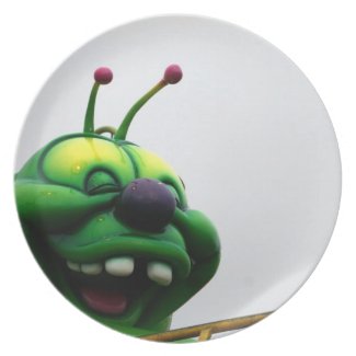 A green caterpillar goofy fair ride image plate