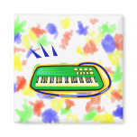 A green keytar with a blue strap graphic, refrigerator magnets