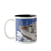 A helicopter clears the flight deck mug