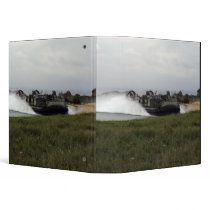 A landing craft air cushion comes ashore vinyl binder