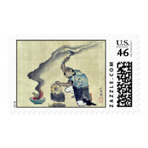 A man engaged in metalwork and a kitten postage stamps