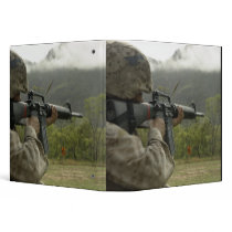 A Marine conducts drills Binders