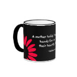 "A mother holds her..." Coffee Mug