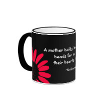 "A mother holds her..." Coffee Mug