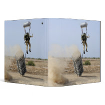 A pararescueman drops into the zone binders
