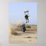 A pararescueman drops into the zone