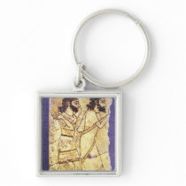 A plaque depicting two men walking key chain