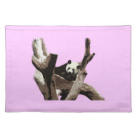 A relaxing giant panda on tree branches place mats