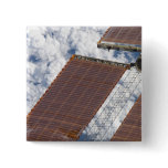 A repaired solar array pinback buttons