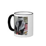 A role-playing enemy aggressor arms a dummy mugs