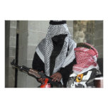 A role-playing enemy aggressor arms a dummy