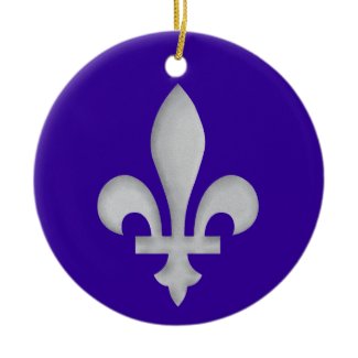 A Silver Fleur-de-lys Christmas Tree Ornament with a blue background
