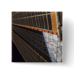 A solar array wing buttons
