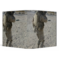 A soldier engages his target on a shooting rang 3 ring binders
