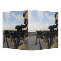 A soldier sights in to fire on a target vinyl binders