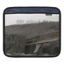 A surfboard sits on the beach in Florida on cliff Sleeve For Ipads
