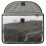 A surfboard sits on the beach in Florida on cliff Sleeves For Macbooks