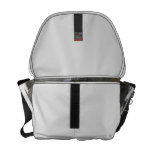 A surfboard sits on the beach in Florida on cliff Courier Bags