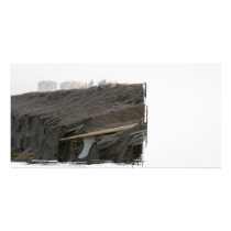 A surfboard sits on the beach in Florida on cliff Photo Greeting Card