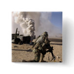 A US Army Soldier reacts to a controlled explos Buttons